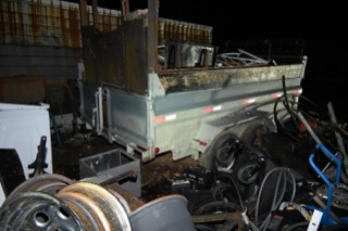 Small utility trailer with a gray metal box.