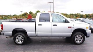 Silver pickup truck parked in a lot