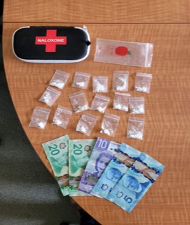 Small baggies of white powder, Canadian twenty and five dollar bills