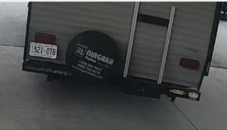 Trailer with ladder and license plate; license plate reads 521-DT8; trailer reads &quot;Niagara Trailers&quot; with contact information.