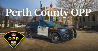 Black OPP cruiser parked in front of a building.