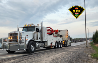 Towing truck on a highway.
