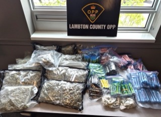 Several clear plastic bags of drugs.