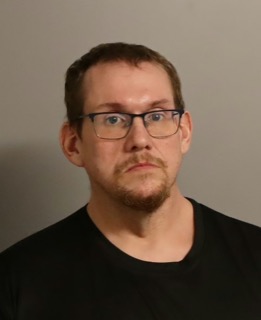 Man with glasses and a goatee