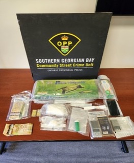 OPP logo and Southern Georgian Bay Community Street Crime Unit, Ontario Provincial Police Stacks of Canadian money and gold bars