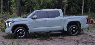 Gray pickup truck on dirt road