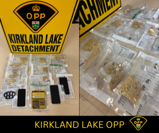 Small baggies of a white powdery substance and a pile of cannabis are displayed on a surface.