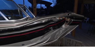 Black boat with red accents.