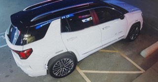 White SUV parked in a parking lot