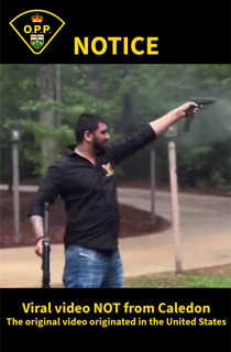 Man holding a handgun, blurred background