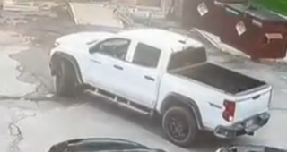 White pickup truck in a parking lot